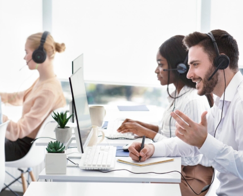 Office workers on internet calls at desk